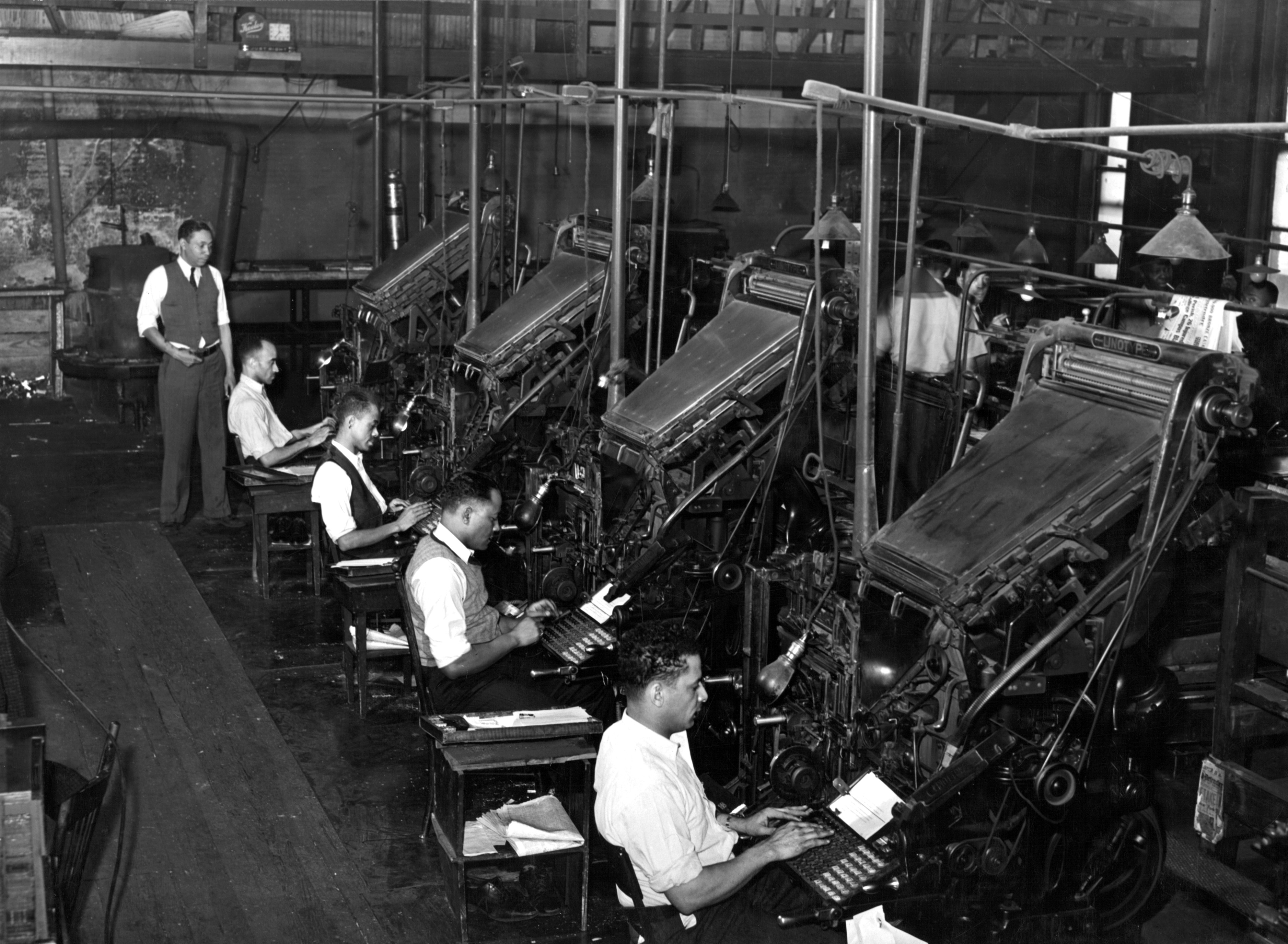 1941, Linotype operators of the Chicago Defender, an African American newspaper in Chicago, Illinois.